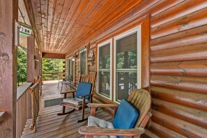 A wooden porch with rocking chairs and a view of the forest. - The Equestrian Hideaway (8-minutes from TIEC)! (Rutherfordton)
