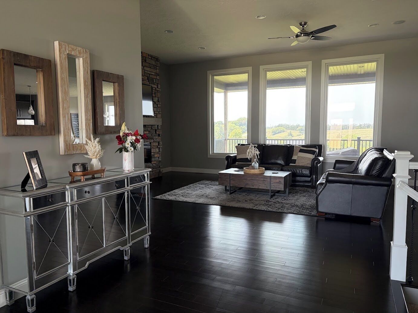 Bright modern living room with large windows and scenic views