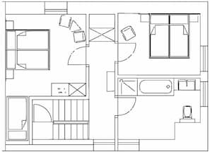 A floor plan with multiple rooms, including a bathroom, a kitchen, and a living area. - Sankt Annagut (Burrweiler)
