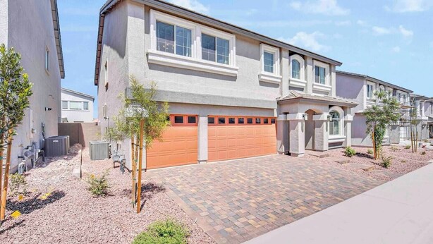 A modern two-story residential building with a garage, paved driveway, and landscaping. - 4000SF LUXE HOME｜Near Strip｜PoolTable｜TV in ALL Rm (Las Vegas)
