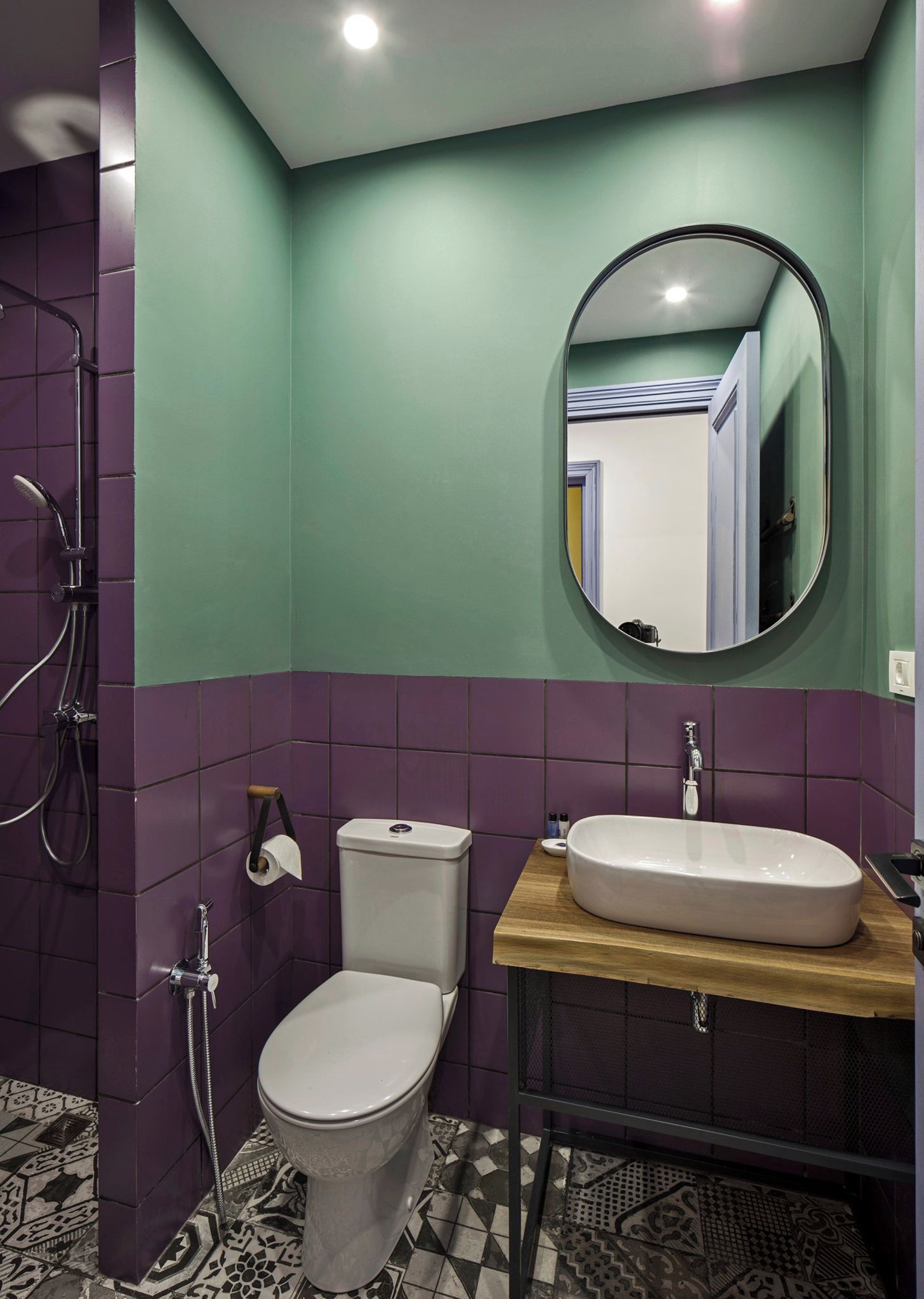 A bathroom with a toilet, sink, and shower.