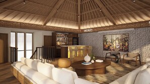A spacious living area with a high ceiling, a bar area, and a large painting on the wall. - The Atma Bali (Denpasar)