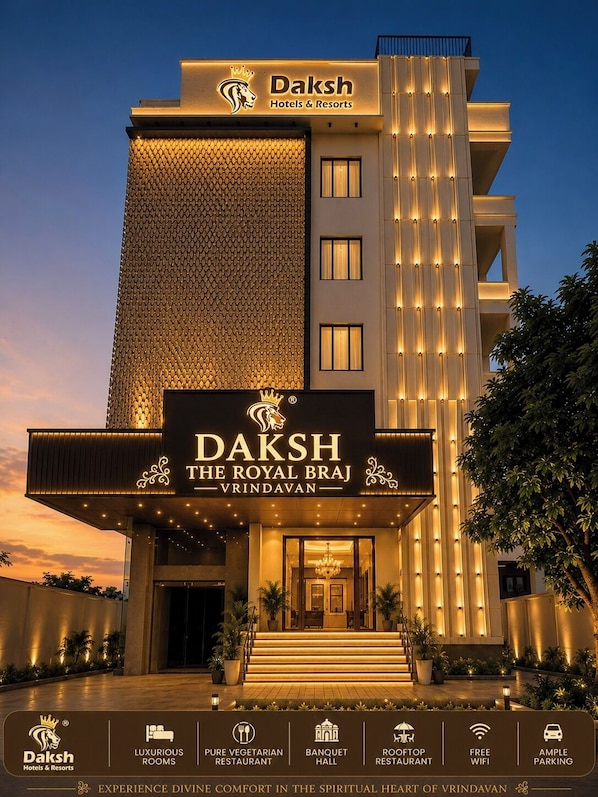 A hotel with a prominent sign reading 'Daksh The Royal Braj Vrindavan' and features include luxurious rooms, a pure vegetarian restaurant, a banquet hall, a rooftop restaurant, free WiFi, and ample parking. - Daksh The Royal Braj Vrindavan (Vrindavan)