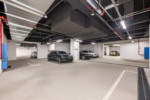 A multi-level underground parking garage with several cars parked. - Crystal Hotel Changde Wuling Pavilion  (Changde)