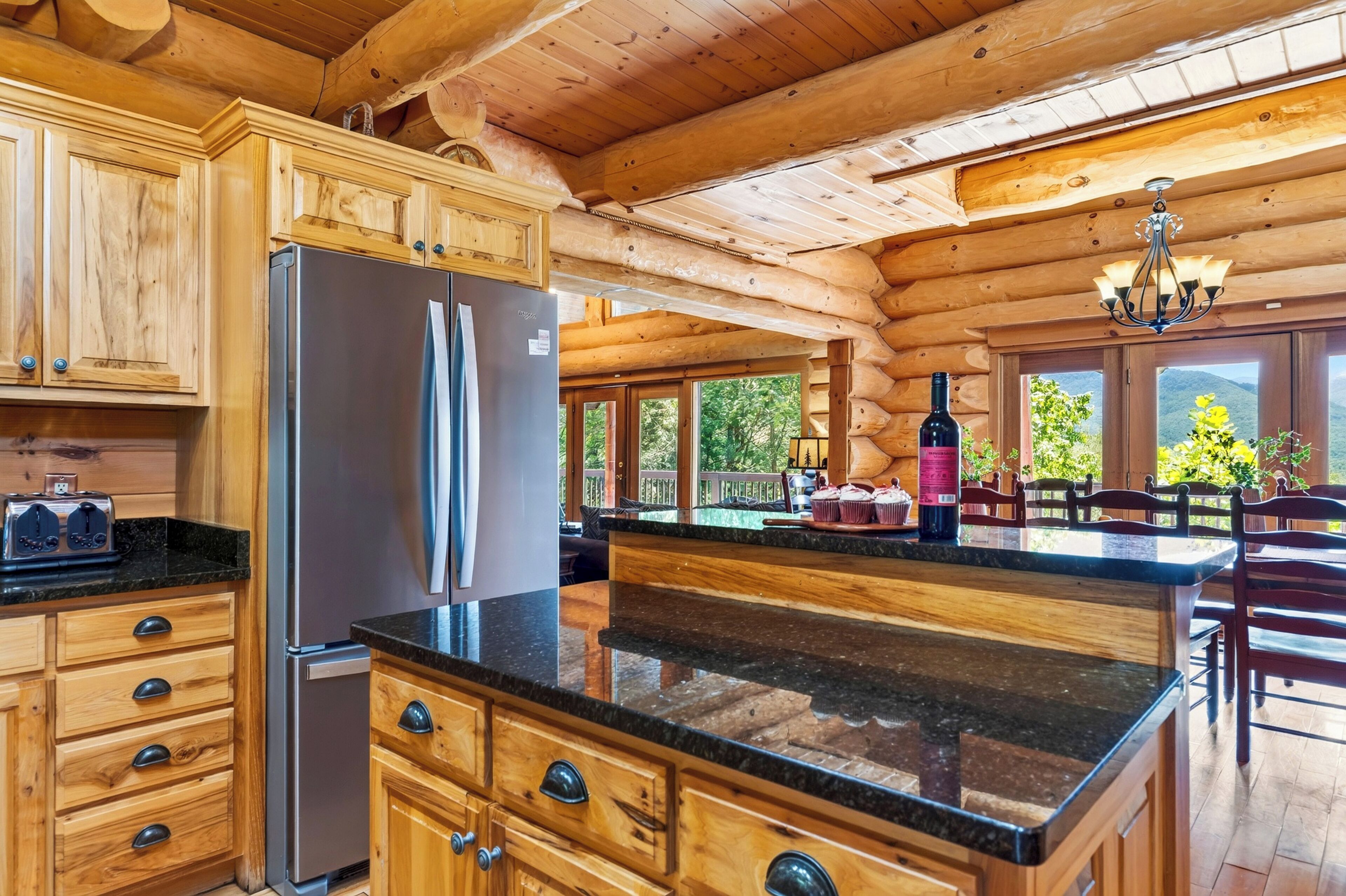 A warm wood kitchen pairs generous counter space with a center island and bar seating for casual meals and easy prep.