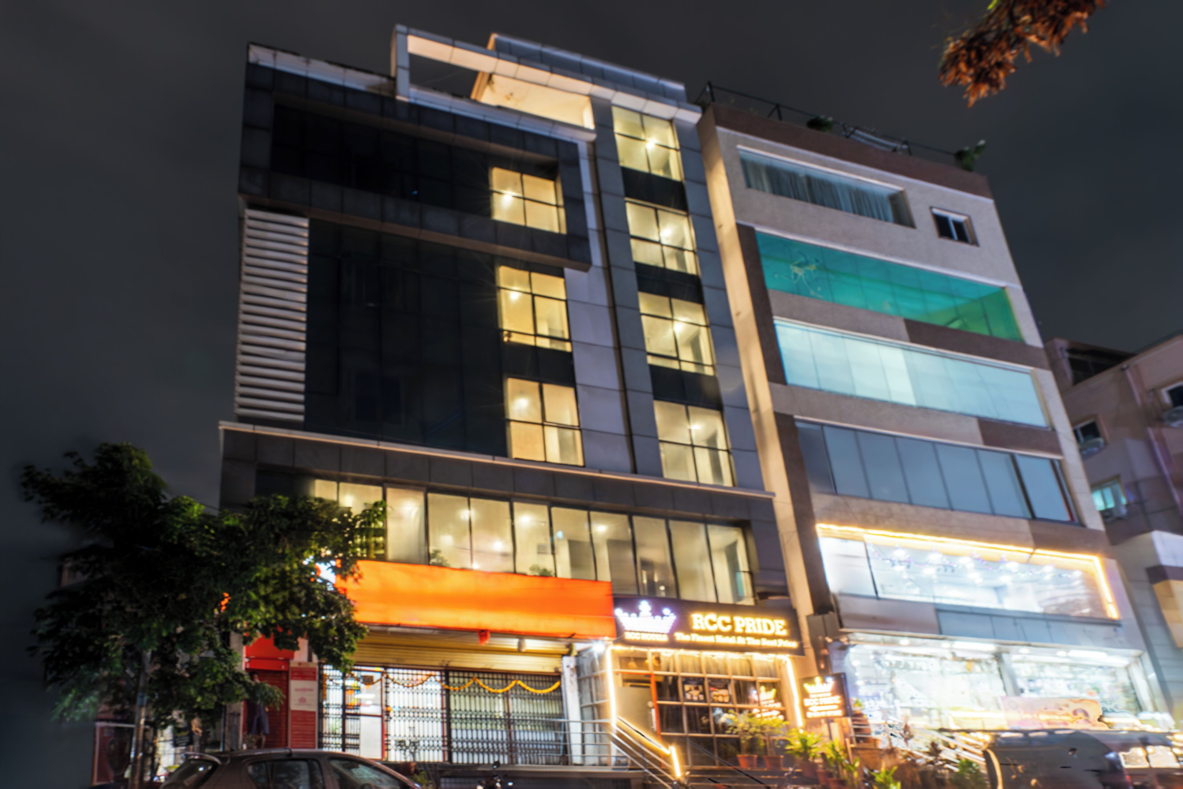 A multi-story hotel with a prominent signage for 'RCC Pride'.