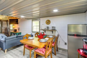 A compact living space with a dining area, kitchenette, and a loft bedroom. - 2 Hot Tubs, Games & BBQs! Henagar Group Retreat (Henagar)