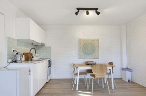 Kitchen Downstairs - Coastal Haven | Ocean Views + Pets Welcome. (Denhams Beach)