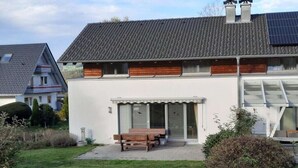 A modern two-story house with a sloped roof, large windows, and a solar panel on the roof. - Ketterer Hinterzarten Black Forest (Hinterzarten)