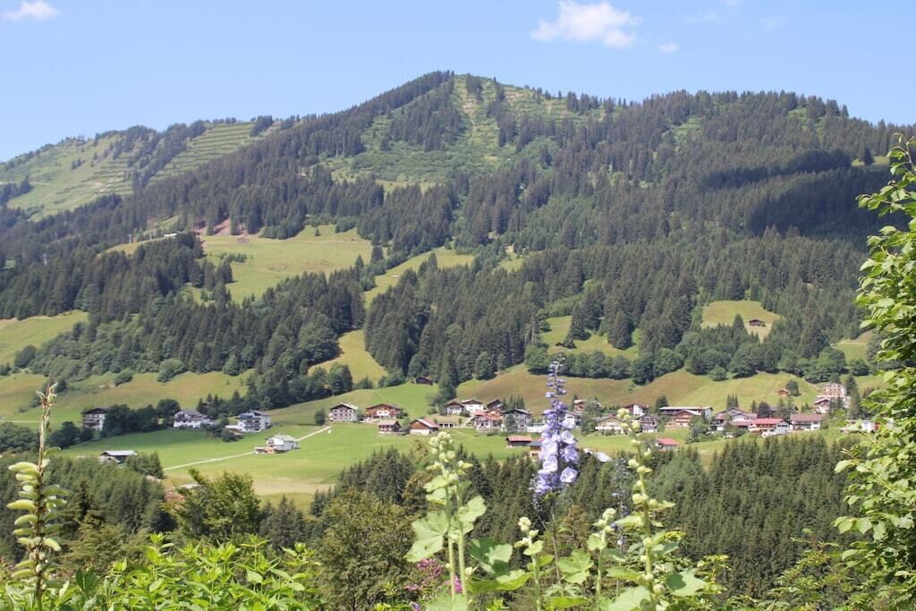 A mountainous landscape with a village nestled among the hills.