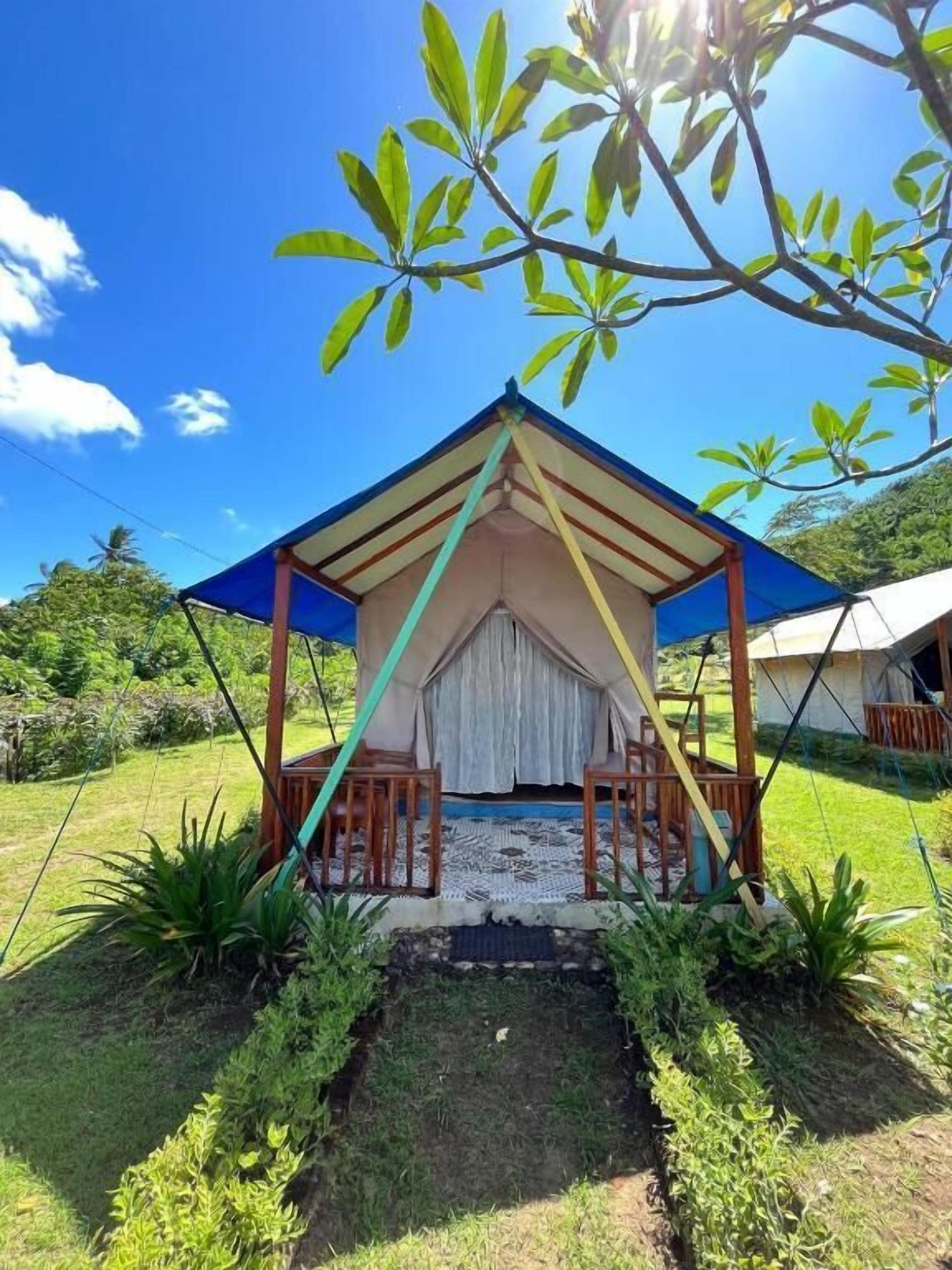 A small, single-story structure with a pitched roof and a covered porch area.