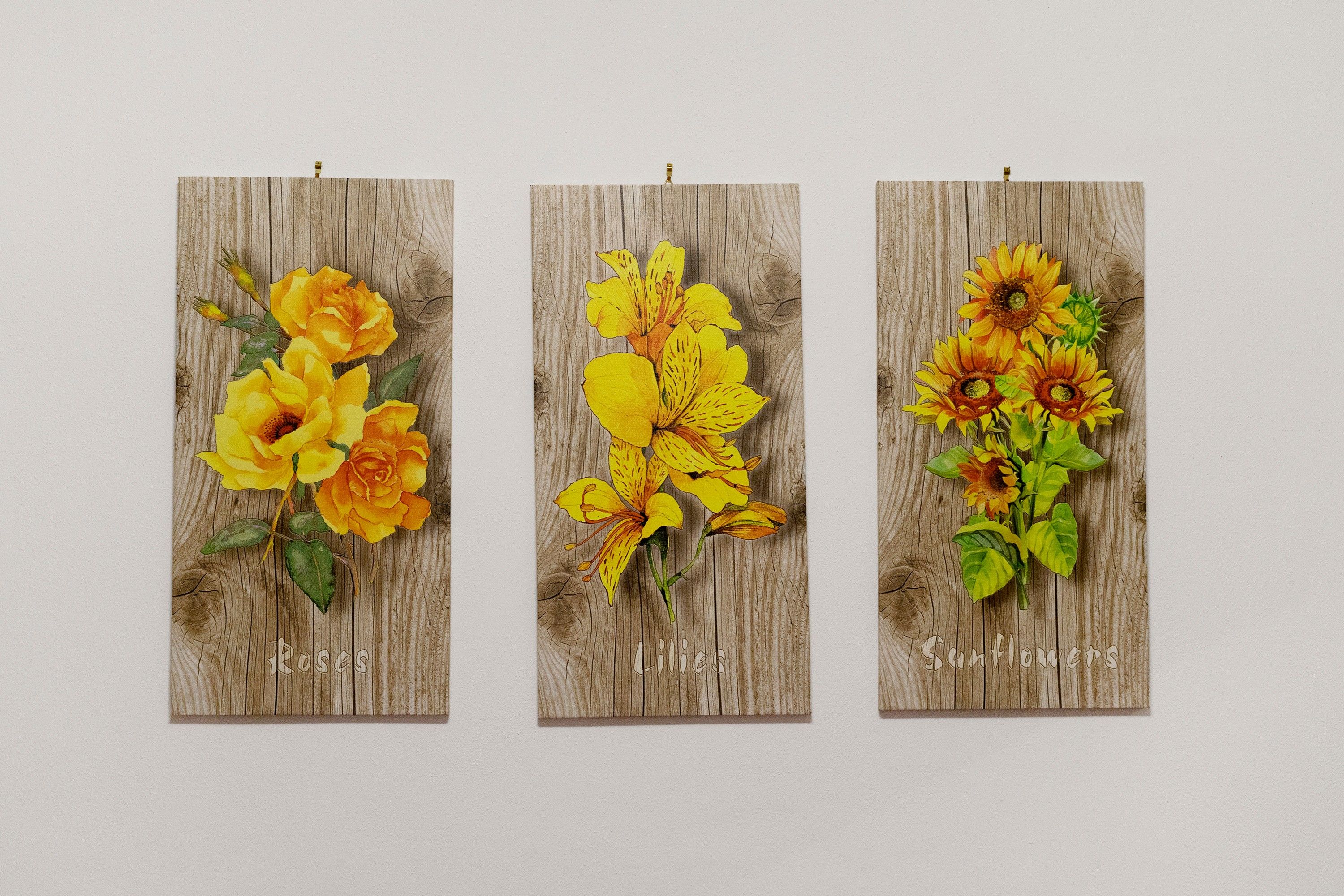 Three vertical panels with floral artwork.