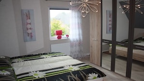 A bedroom with a large bed, a window with curtains, a radiator, and a mirror. - Holiday home in Cuxhaven with swimming pool (Cuxhaven)
