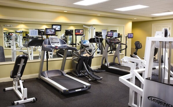 A gym with treadmills, elliptical machines, and weight machines. - Sevierville | Pool & Mountains | Nature Escape Stay (Sevierville)
