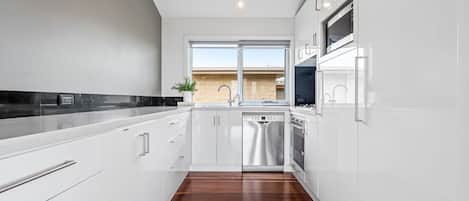 Coffee/tea maker, fridge, microwave, oven
