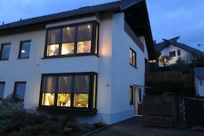 A modern two-story house with large windows and a visible number '23' on the facade. - Holiday apartment in Konz with swimming pool (Konz)