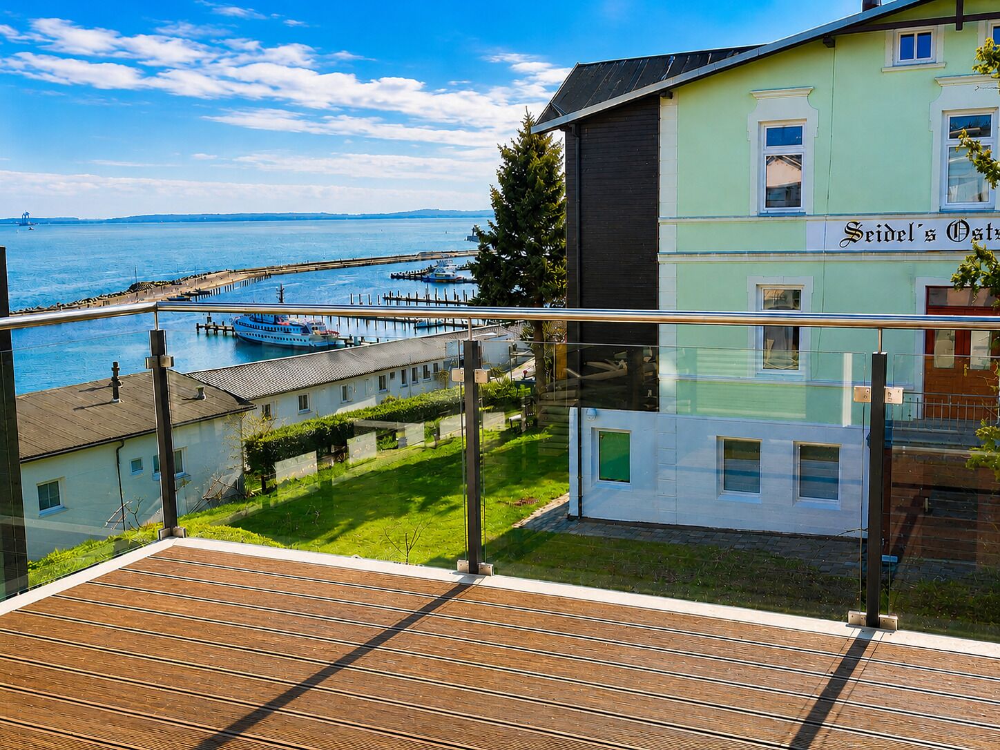 A coastal building with a sign reading 'Seidel's Osthaus.'