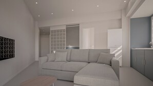 Una sala moderna con un sofá modular, una mesita de madera y un mueble gris.