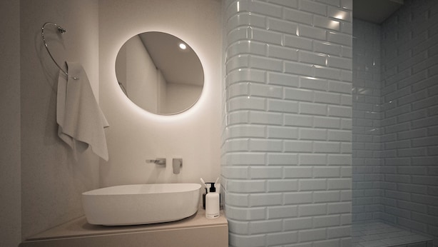 Ein modernes Badezimmer mit rundem Spiegel, Waschbecken und Duschbereich.