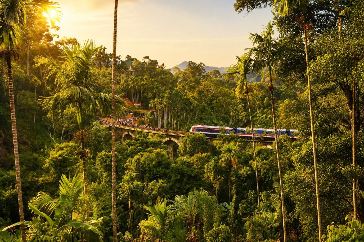 Un tren cruzando un puente en un paisaje exuberante y verde, con abundante follaje y cielo despejado.