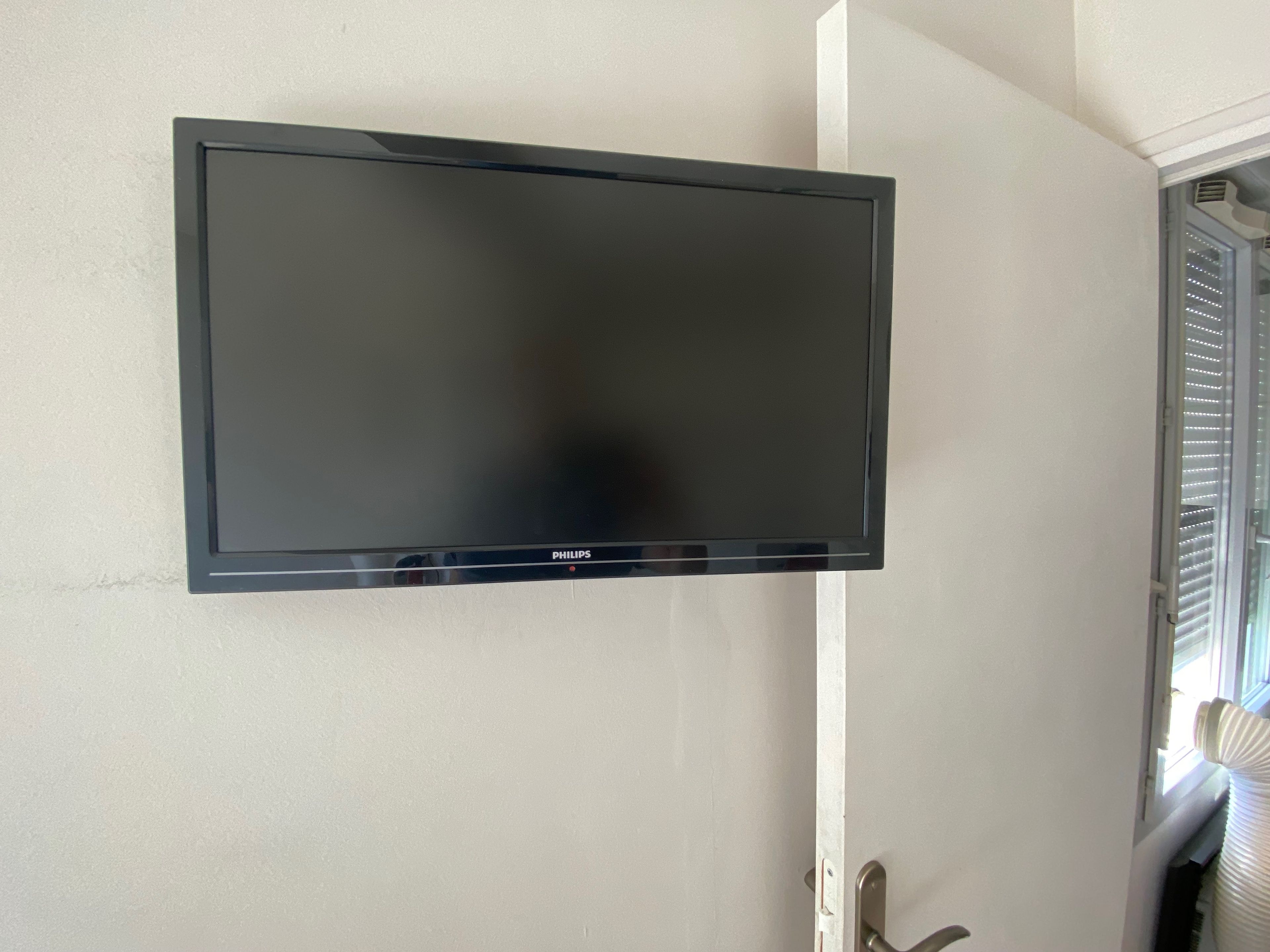 A flat-screen television mounted on a wall.