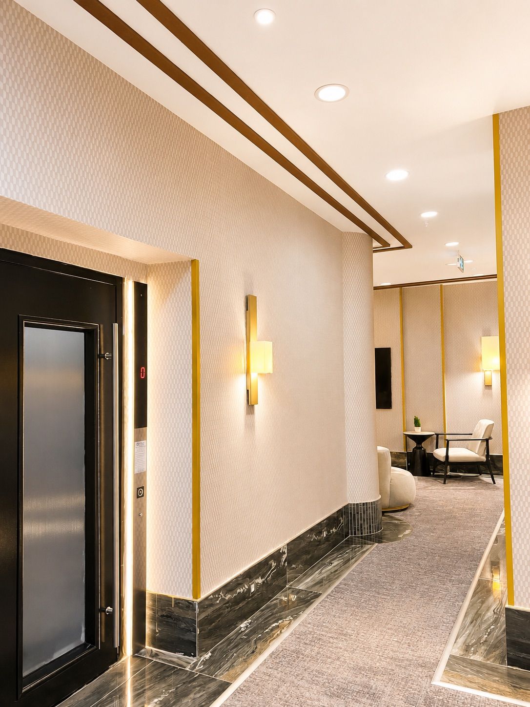 A modern hotel corridor with a marble floor, recessed ceiling lights, and a black elevator door.