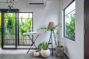 A room with a piano, potted plants, and a large window with a view of greenery. - Senja Villa – Peaceful modern villa in tropical Bali (Kediri)