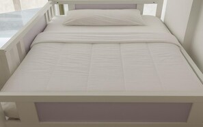A white bed with a headboard, a pillow, and a mattress. - TIDY Premium Hostel Dubai (Dubai)