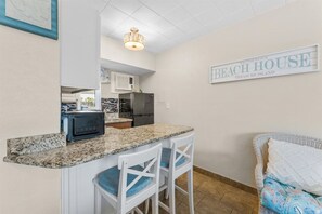 Kitchen and Counter Seating - 🌞Beachfront Property🌴Pool/Shuffleboard/Grills🐠Tropic Terrace 31 (Treasure Island)