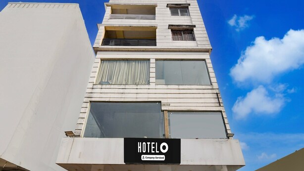 A hotel building with a sign reading 'HOTELO' and a company-serviced logo. - Classic With View Mivaan Comfort (Barasat)