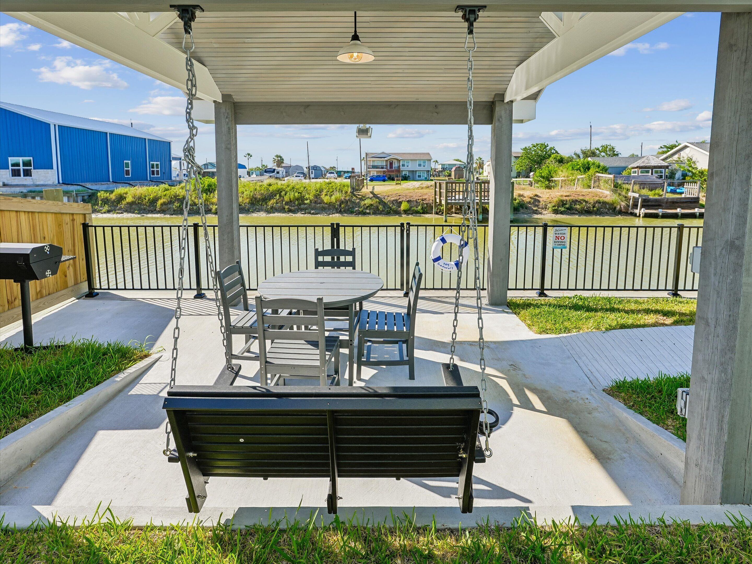 Covered Patio w/ Outdoor Seating Overlooking Canal - The Ginger