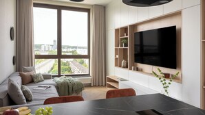 A modern living room with a large window, a flat-screen TV, a dining area, and a sofa. - Bulvar Penthouse Collection Gdańsk (Gdańsk)