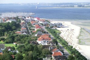 A coastal residential area with houses, a beach, and a marina. - Holiday apartment in Laboe with swimming pool (Laboe)