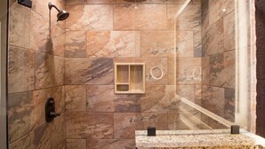 A shower with a glass enclosure, a handheld showerhead, and a wall-mounted control. - Spend Christmas week in a beautiful Smoky Mountain resort with onsite waterpark! (Gatlinburg)