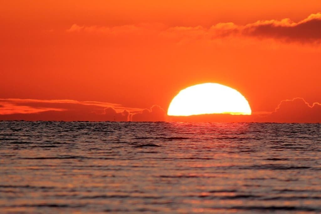 A sunset over a body of water.