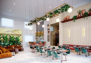 A modern interior with a seating area, tables, and a bar.