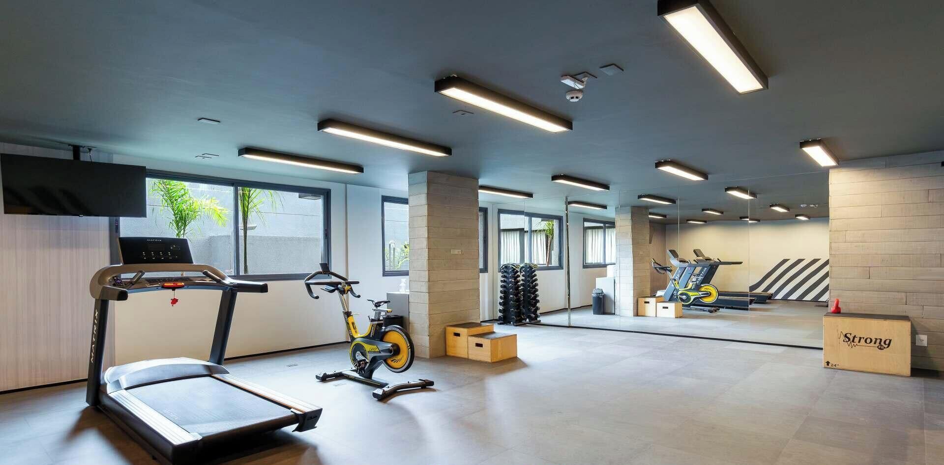 A gym with treadmills, an exercise bike, and a stair climber.