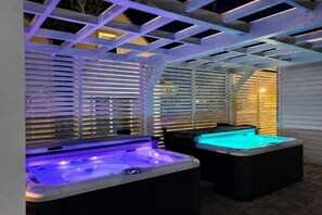 An outdoor hot tub area with a covered structure and a pool table. - Comfortable holiday homes with SPA Rewal (Rewal)