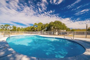 A clear blue swimming pool with a white fence and trees in the background. - Romar Village 312  Family-Friendly Beach Retreat (Orange Beach)