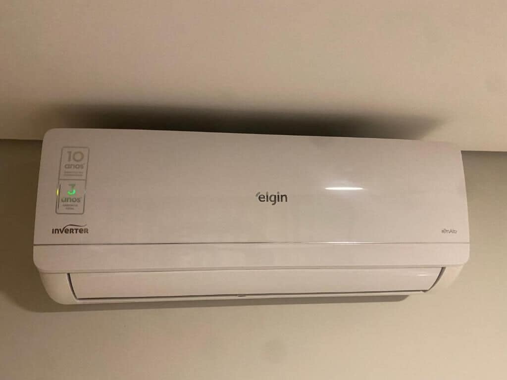 A white inverter air conditioner unit with the brand name 'elgin' on the top.