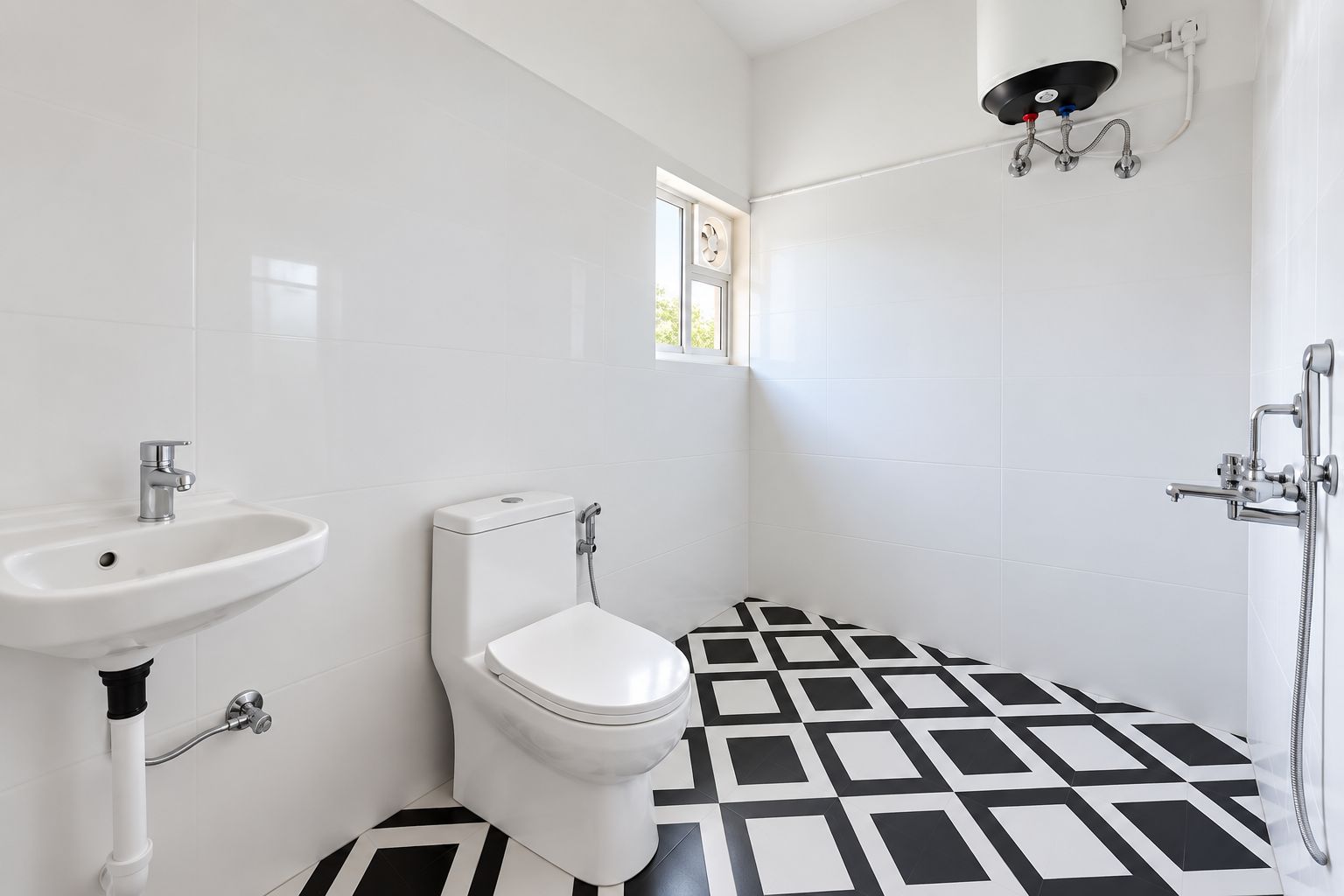 A bathroom with a white sink, toilet, and shower.
