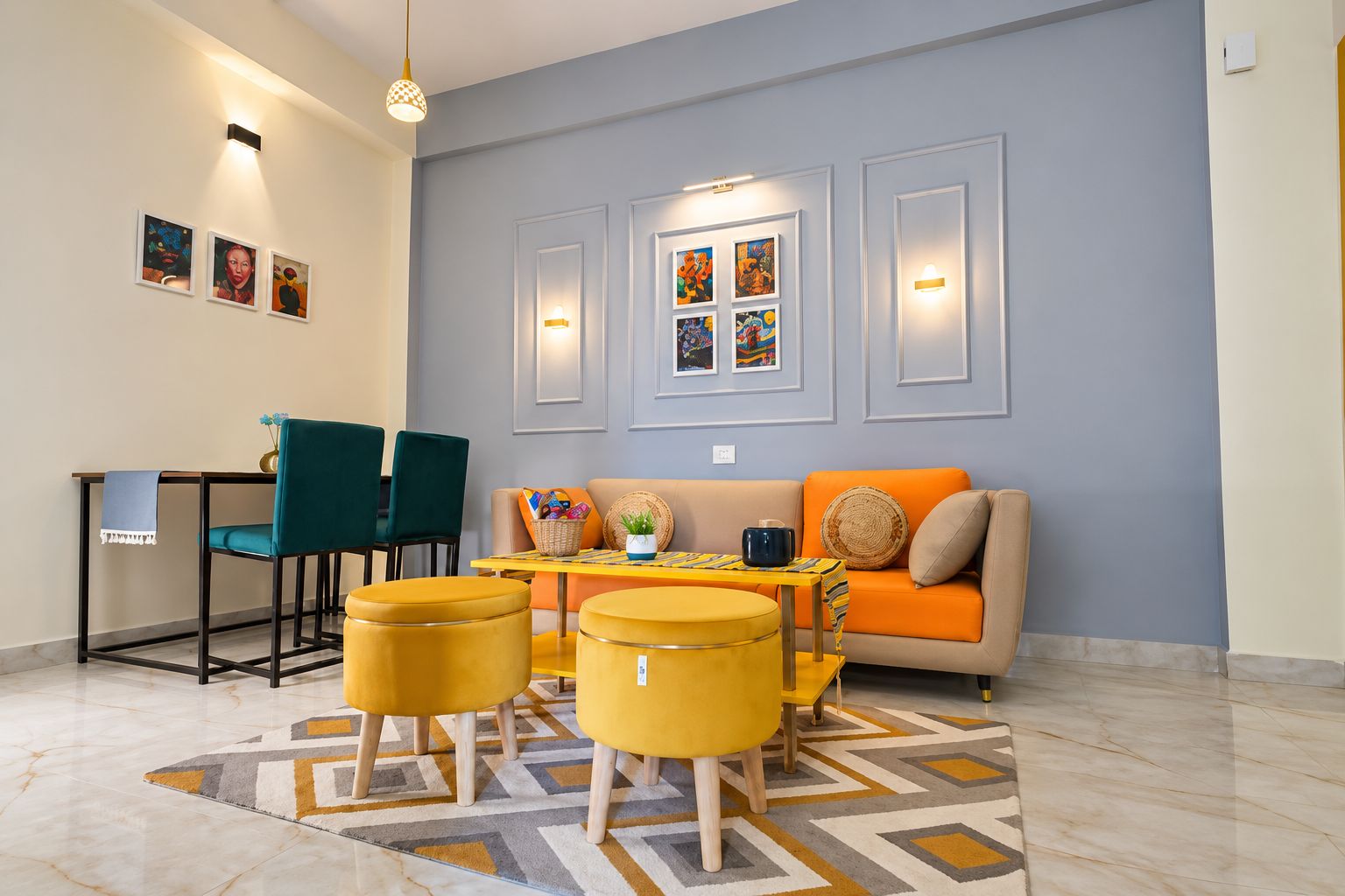 A modern living room with a sofa, two chairs, a table, and a patterned rug.