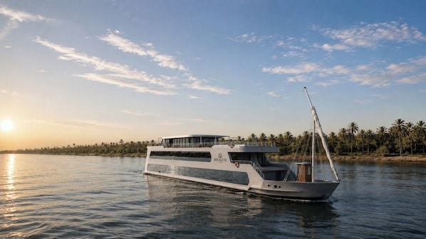 A river cruise boat with a covered upper deck and a cabin structure. - Rafaheya Nile Cruise Monday 4 nts Luxor - All Inclusive (Luxor)