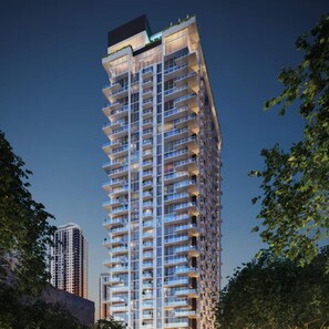 A high-rise building with multiple balconies, likely a hotel or residential complex. - The Crosby Worldcenter 2BR Palermo Home  (Miami)