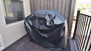 A covered grill on a wooden deck. - Entrada at Moab 624 and 632 (Moab)