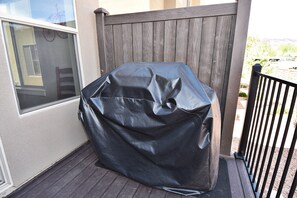 A covered grill on a wooden deck. - Entrada at Moab 624 and 632 (Moab)