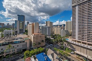 A high-rise building with multiple floors, surrounded by other tall buildings, and a clear sky with clouds. - Ocean & Iconic Waikiki Views From the Marine Surf by the Beach W/full Kitchen (Honolulu)