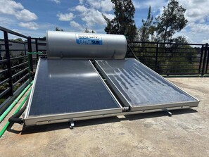 A solar water heater with a cylindrical tank labeled 'Dayliff Ultrasun' mounted on a rooftop. - Prime Elgon View 5BR Family Home Private Secure in Eldoret (Eldoret)