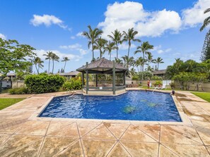 A swimming pool with a gazebo, palm trees, and a clear sky. - Exclusive Golf Course Front Kuilima West by Beach W/parking & Great Amenities (Kahuku)