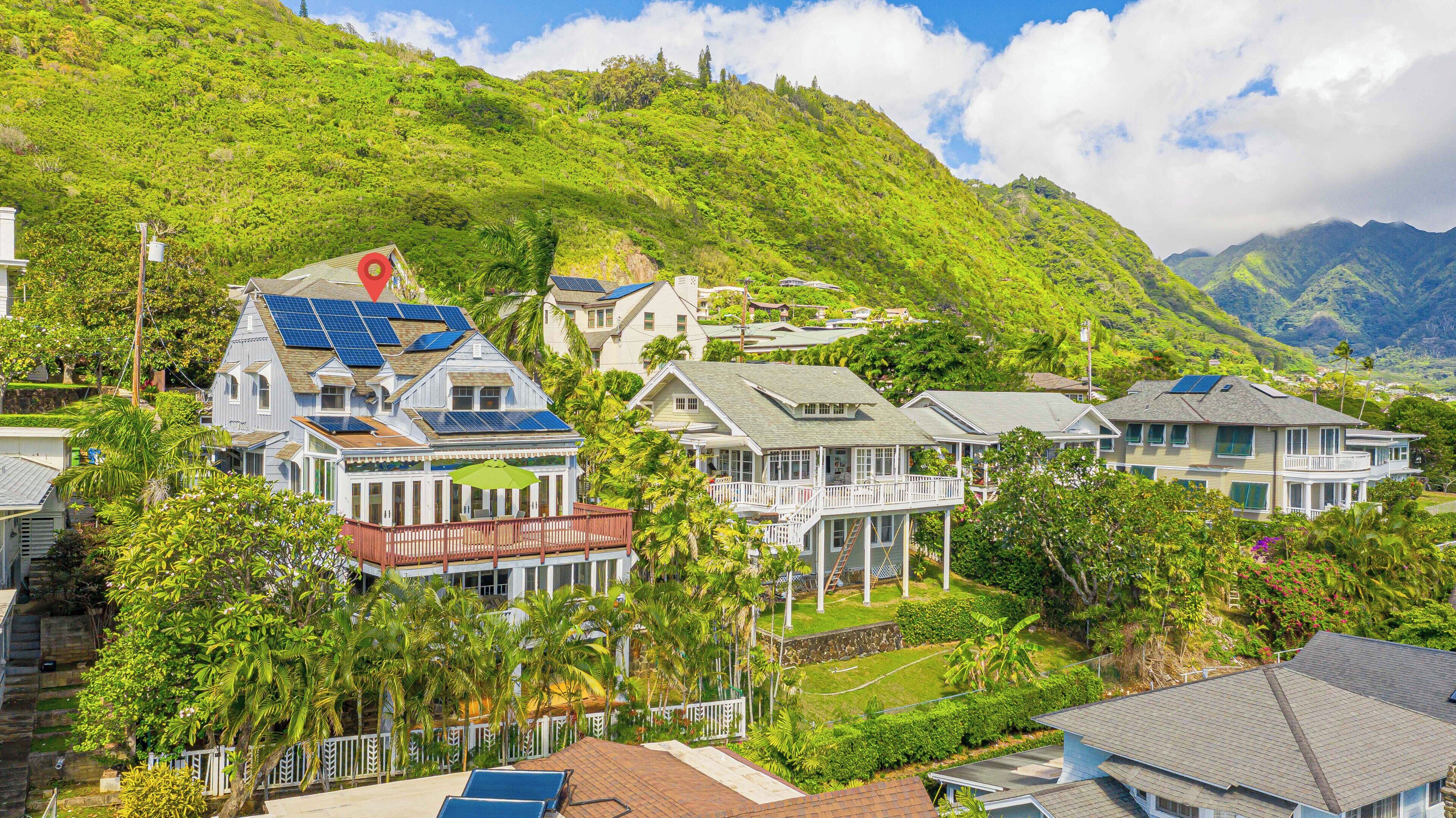 A coastal residential area with houses featuring balconies and solar panels.